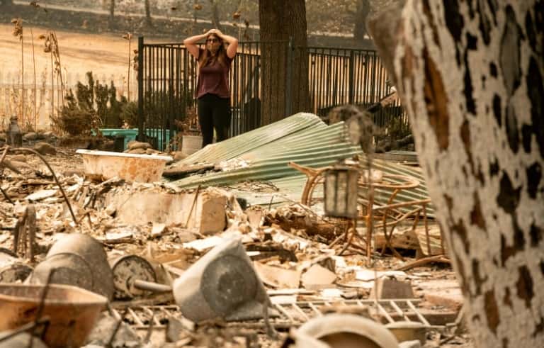 Une habitante découvre ce qu'il reste de sa maison détruite par l'incendie <em>LNU Lightning Complex</em>, le 23 août 2020, à Vacaville. © Josh Edelson, AFP