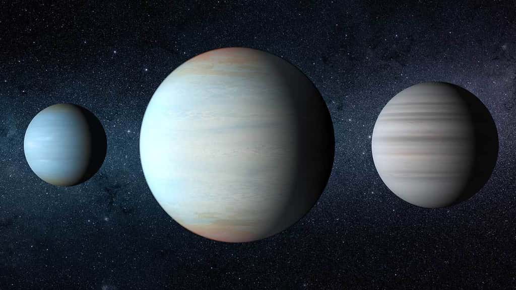 Vue d'artiste des trois exoplanètes en orbite autour de l'étoile double Kepler 47. Celle de gauche est Kepler 47b, celle de droite est Kepler 47c. Elles ont été découvertes en premier. Au milieu, se trouve la planète la plus récemment découverte, Kepler 47d. Leur ordre de découverte ne correspond pas à leur ordre dans le système planétaire. © Nasa/JPL Caltech/T. Pyle