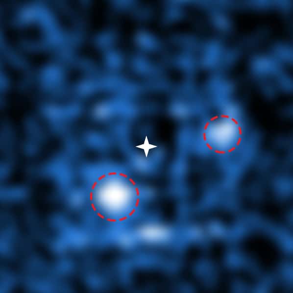 La grande luminosité de l’étoile PDS 70 a été éliminée de cette image de Muse sur le VLT après traitement des données. Les astronomes ont ainsi pu distinguer les deux jeunes planètes géantes qui sont en train de découper le disque protoplanétaire. © ESO, S. Haffert (<em>Leiden Observatory</em>)