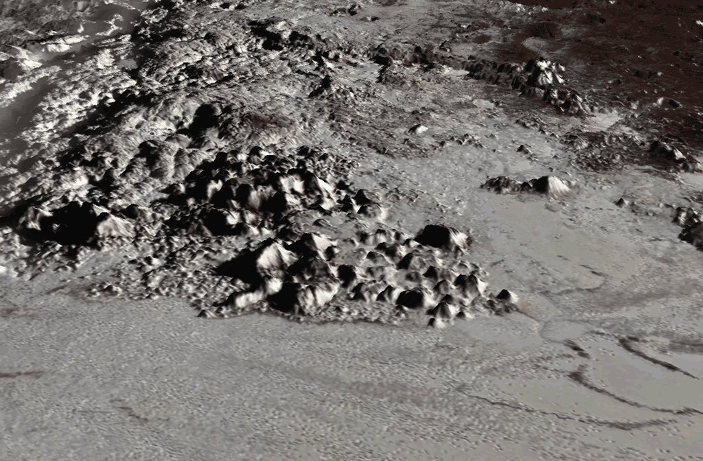 Voici Tenzing Montes, les plus hautes montagnes de Pluton. Vue en perspective de la chaîne de montagne située sur la bordure ouest de la plaine Spoutnik. © <em>Lunar and Planetary Institute</em>, Paul Schenk