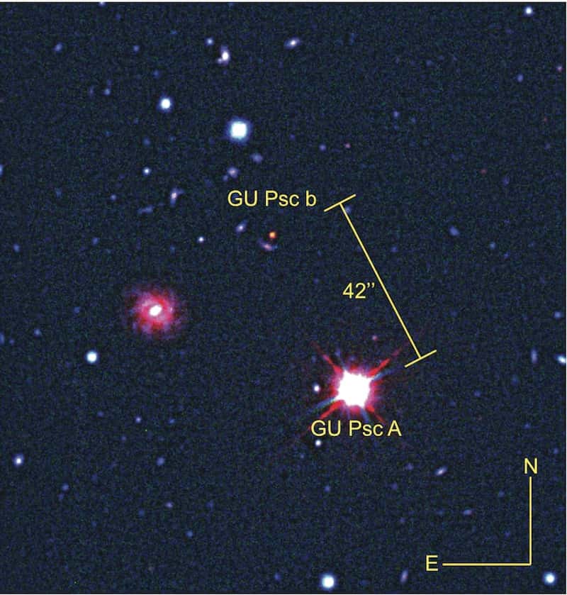 Image composite (rayonnements visible et infrarouge) de la naine rouge GU Psc et de la planète géante qui lui gravite autour à 2.000 unités astronomiques, GU Psc b. Malgré une distance avec la Terre de 155 années-lumière, les deux astres restent bien séparés sur ces images capturées par les télescopes Gemini-Nord et CFHT. © CFHT, Gemini