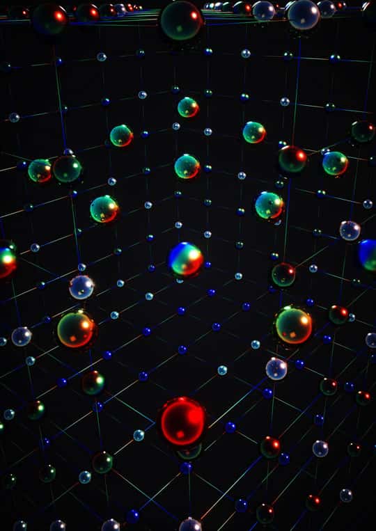 Cette vue d’artiste montre les corrélations magnétiques complexes que les physiciens de l’université de Kyoto (Japon) ont observé dans leurs atomes d’ytterbium refroidit des milliards de fois plus que l’espace interstellaire. Les couleurs représentent les six états de spin possibles pour chaque atome. © Ella Maru Studio, K. Hazzard, Université Rice