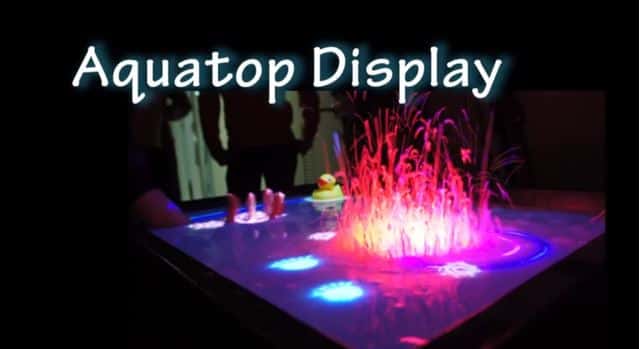 AquaTop se compose d’un projecteur vidéo, d’un capteur Kinect et d’enceintes étanches. Sur une surface liquide rendue opaque par des sels de bain, l’image projetée peut être manipulée avec les mains et les doigts, et le son subaquatique fournit même un retour d’effet synchronisé avec l’action. Ci-dessus une explosion simulée dans le cadre d’un jeu vidéo. © Laboratoire d’électrocommunication de l’université de Tokyo, YouTube