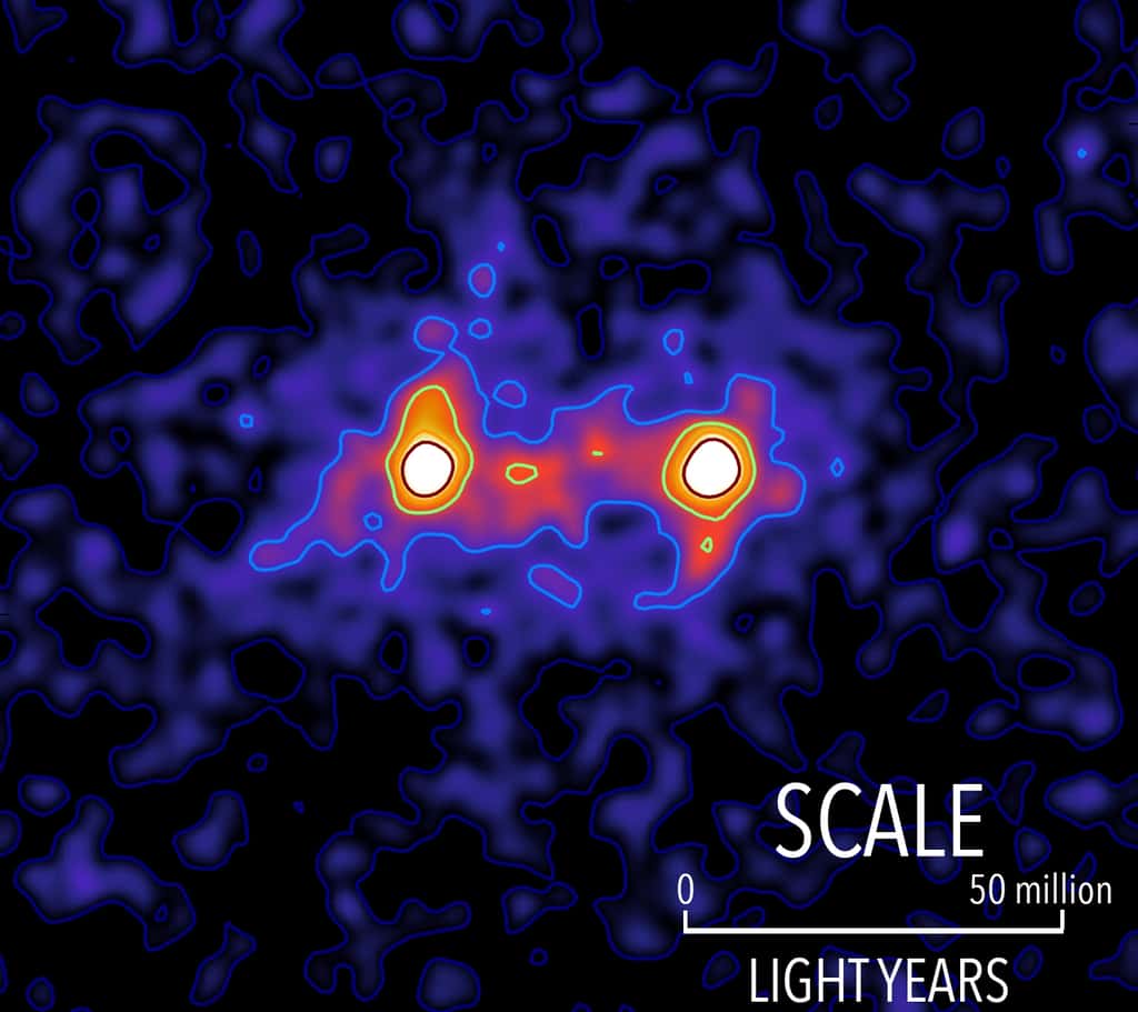 Cette image en fausse couleurs a été obtenue en étudiant l'effet de lentille gravitationnelle faible produit par un très grand nombre de paires de galaxies situées à environ 4,5 milliards d'années-lumière de la Voie lactée. Les taches blanches représentent deux galaxies. © S. Epps & M. Hudson, <em>University of Waterloo</em>