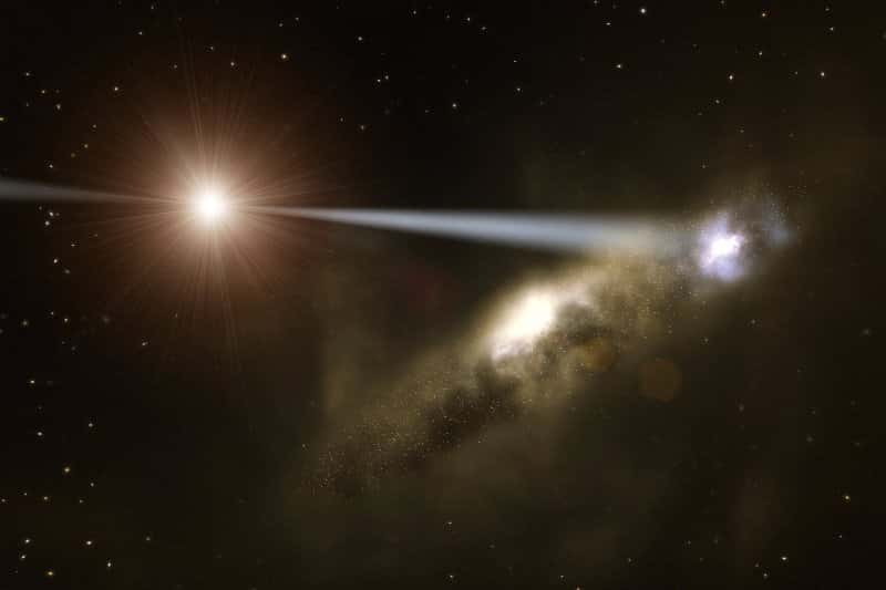 Une image d'artiste montrant le jet de particules de HE0450-2958 à l'origine d'une flambée de nouvelles étoiles dans la galaxie au premier plan. © ESO/L. Calçada