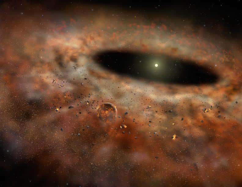 Une vue d'artiste du disque de poussière autour de TYC 8241 2652. Une planète (hypothétique) y est visible encore en formation, bombardée par des petits corps célestes qui eux-mêmes entrent en collision. C'est un disque de débris. © <em>Gemini Observatory</em>-Lynette Cook