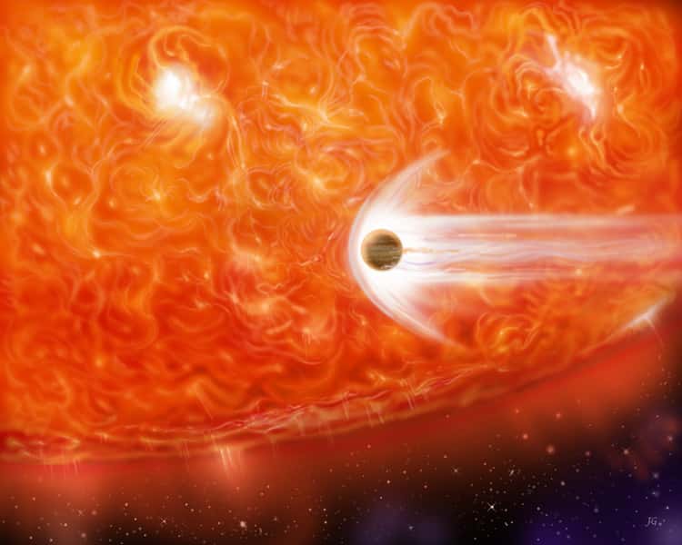 Une géante rouge dégage un rayonnement lumineux tellement puissant qu’il met en rotation les astéroïdes jusqu’à ce qu’ils se brisent en deux successivement. © Nasa