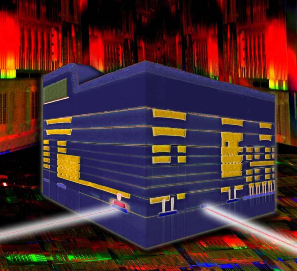 Ce circuit nanophotonique est le fruit de 10 ans de recherche chez IBM. Cette illustration montre le cube de silicium de 0,5 mm de côté. Il intègre tous les éléments constituant un émetteur-récepteur. Sur le flanc gauche se trouve le photodétecteur optique (en rouge). Le modulateur (qui modifie à la demande le signal lumineux) est placé sur la partie droite du cube (en bleu). © IBM Labs