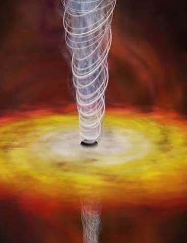 Vue d'artiste d'un trou noir super massif niché au coeur d'une galaxie <br />Le gaz s'échauffe en approchant du trou noir, passant du rouge au blanc<br /> La majorité du gaz est avalée par le trou noir, mais une partie est éjectée à une vitesse proche de celle de la lumière<br /> (Crédits : CXC/M. Weiss)