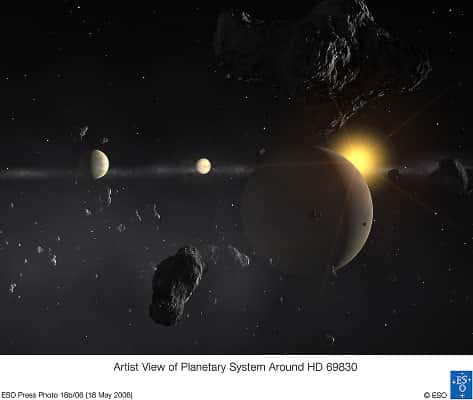 Vue d'artiste du système planétaire découvert par le chasseur de planètes HARPS<br /> (Crédits : ESO)