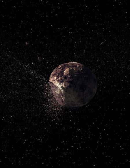 Une vue d'artiste d'une collision entre Pallas et un petit corps céleste éjectant des débris à l'origine de la familles des astéroïdes qui lui sont restés associés. Crédit : <em>Science</em>