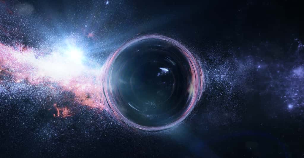 Grâce à l’effet de lentille gravitationnelle exercé sur une galaxie lointaine et à quelques simulations informatiques, des chercheurs de l’université de Durham (Royaume-Uni) nous présentent l’un des plus grands trous noirs jamais détectés. © dottedyeti, Adobe Stock