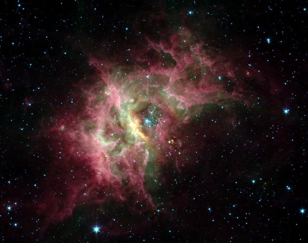 La nébuleuse galactique RCW 49 est l’une des régions de formation d’étoiles les plus actives de la Voie lactée. En son cœur, l’amas Westerlund 2 étudié par les chercheurs de l’université du Maryland. © Nasa, JPL Caltech, E. Churchwell, Université du Wisconsin