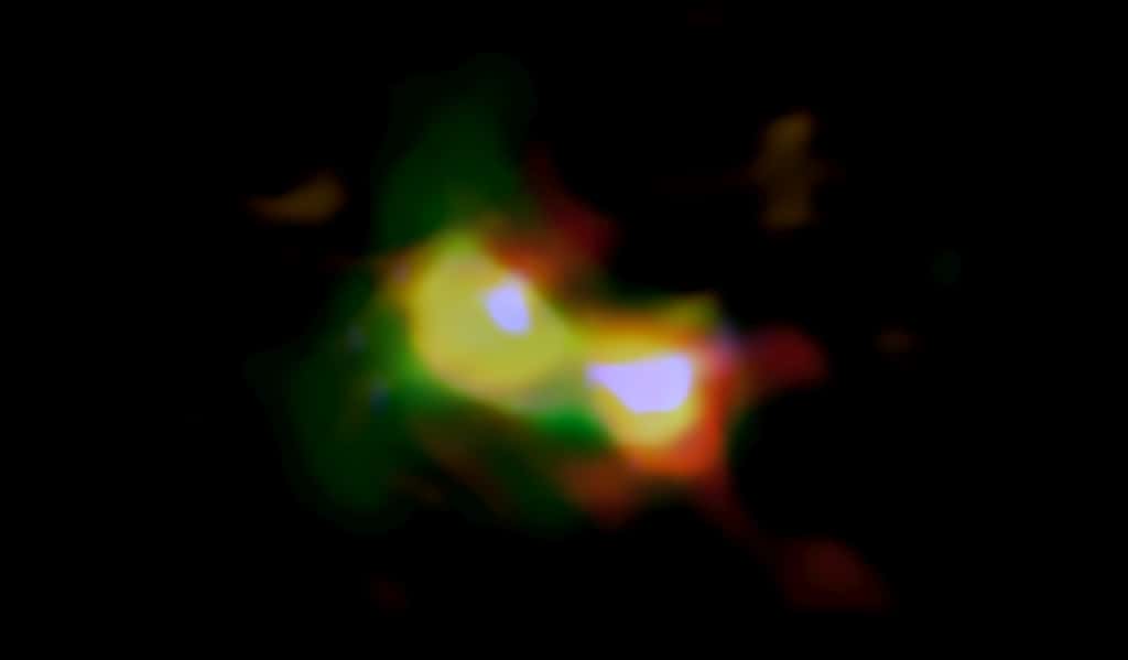 Image composite en fausses couleurs de B14-65666 montrant les distributions de poussière (rouge), d'oxygène (vert) et de carbone (bleu), observées par ALMA et d'étoiles (blanches) observées par le télescope spatial Hubble. © Alma (ESO/NAOJ/NRAO), télescope spatial Hubble Nasa/ESA, Hashimoto et al.
