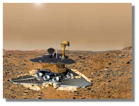 Le rover vient de se poser sur Mars amorti pas ses coussins gonflables. Quand la sonde s'est stabilisée, les airbags sont rétractés et les 3 pétales sont alors ouverts. Le rover est encore compacté dans son logement. Il faudra pas moins d'une semaine pour qu'il pose enfin ses roues sur la poussières de Mars. &copy; NASA / JPL 