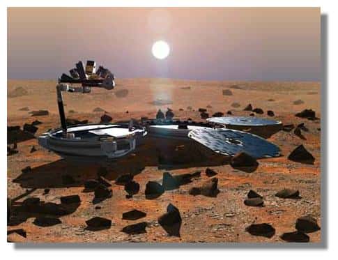 Beagle-II sur Mars. Les pétales portant les panneaux solaires sont déployés. Le bras robotique équipé de nombreux instruments apparaît sur le dessus. &copy; Open University / ESA