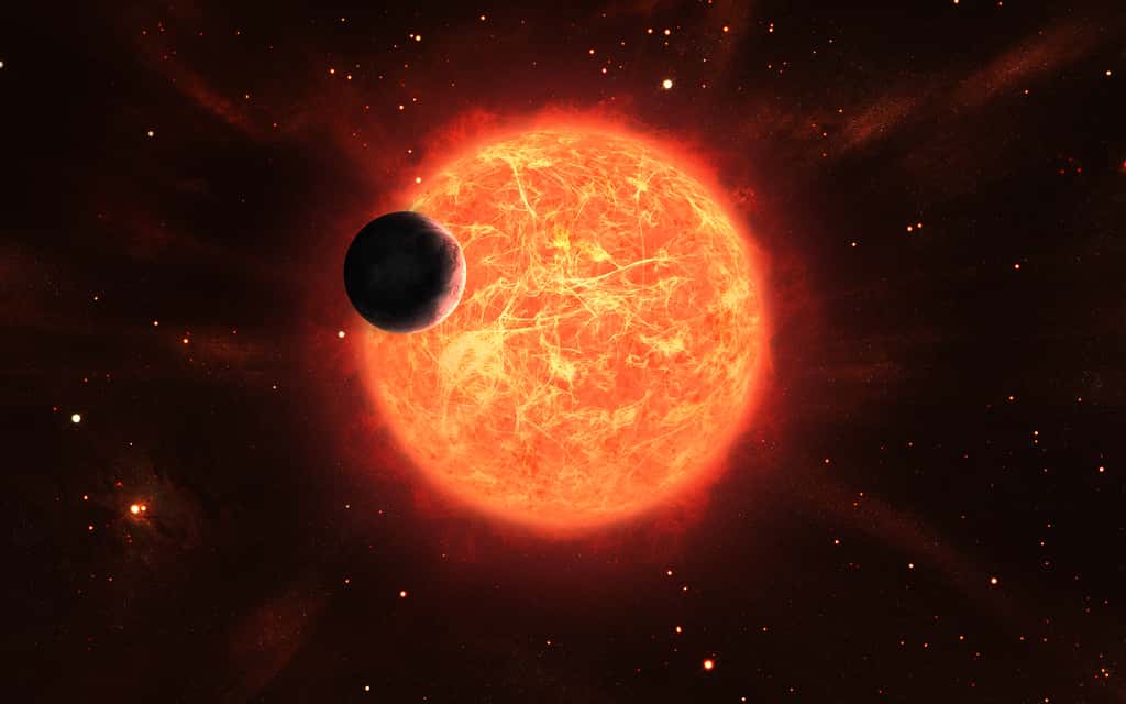 Vue d'artiste d'une planète autour d'une étoile géante rouge. © Lev, Adobe Stock