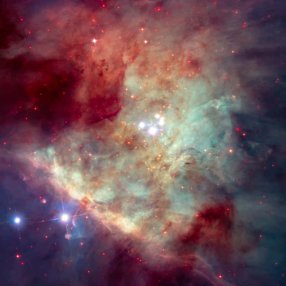 L'amas du Trapèze au cœur de la nébuleuse d'Orion photographié par Hubble. Ces étoiles massives sculptent l'intérieur du nuage où elles sont nées il y a plusieurs centaines de milliers d'années. La structure nommée « barre d'Orion » est visible en diagonale, en bas à gauche de l'image. © Nasa, ESA, Massimo Robberto (STScI, ESA), Alyssa Pagan (STScI)