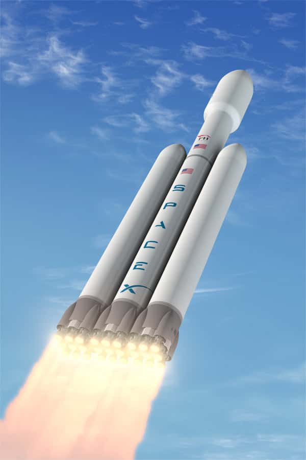 Vue d'artiste du Falcon Heavy, le lanceur lourd en projet de SpaceX, avec les 27 moteurs de son premier étage. © SpaceX