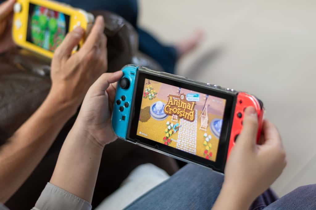 La Nintendo Switch propose trois différentes versions que nous vous présentons dans ce guide © Khunatorn, Adobe Stock