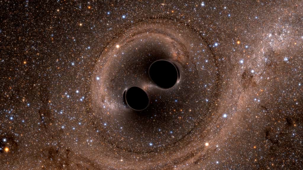 Une simulation montrant la fusion de deux trous noirs. © SXS