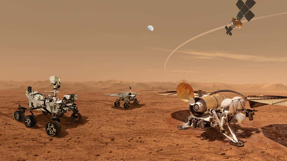 Conceptualisation de la mission MSR : à gauche, Perseverance rejoint par le <em>Sample Retrieval Lander</em> à droite, l'<em>Earth Return Orbiter</em> dans le ciel et le rover chargé de récupérer les échantillons en arrière-plan. © Nasa, JPL-Caltech