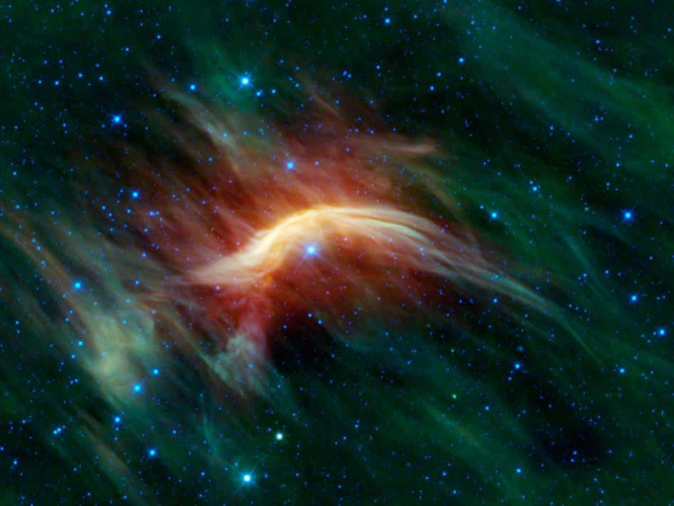 Ce magnifique arc de choc imagé dans l’infrarouge par Wise est produit par l’étoile Zeta Ophiuchi, 20 fois plus massive que le Soleil. Si elle n’était pas obscurcie par la poussière du milieu interstellaire, elle serait une des étoiles les plus brillantes dans le ciel terrestre. © Nasa, JPL-Caltech, UCLA