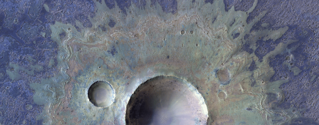 La caméra CaSSIS de la sonde TGO permet d'obtenir des images en fausses couleurs des cratères martiens (ici dans Valles Marineris), ce qui permet de déterminer la composition du sol. © ESA/TGO/CaSSIS