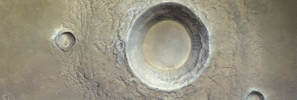 Ce cratère situé dans Utopia Planitia présente des éjectas à l'apparence bien particulière qui pourraient indiquer que l'astéroïde a impacté un sol riche en glace d'eau. © ESA/TGO/CaSSIS