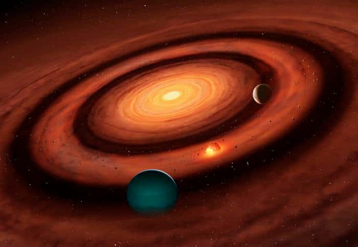 Contrairement au modèle conventionnel de la formation des systèmes solaires, une nouvelle étude explique comment une petite planète peut se former entre deux géantes gazeuses. © Dr Mark Garlick, <em>University of Warwick</em>