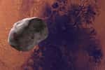 Illustration de Phobos passant devant Mars. © ianm35, Adobe Stock
