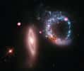 Cette image composite de l'anneau lumineux associé à Arp 147 superpose une vue prise dans le visible par le télescope Hubble et celle en rayons X de l'observatoire Chandra. © X-ray: Nasa/CXC/MIT/S.Rappaport et al, Optique : Nasa/STScI
