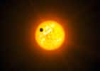 Une vue d'artiste d'une exoplanète en transit devant son étoile. © ESO, L. Calçada