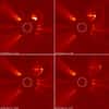 Extraites d'une animation vidéo réalisée par le coronographe du satellite Soho, ces quatre images montrent l'importante bulle de plasma qui s'est développée dans la couronne solaire le 13 avril 2010. Crédit Nasa/Esa/Soho
