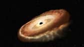 Des observations menées à l’aide du spectrographe ultraviolet dont est équipé le télescope spatial Hubble montrent une étoile transformée en donut cosmique par un trou noir à quelque 300 millions d’années-lumière de notre Terre. © Nasa, ESA, Leah Hustak (STScI)