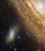 La galaxie M 110 à côté des bras imposants de la grande galaxie d'Andromède M 31. Crédit Canada-France-Hawaii Télescope