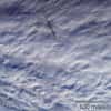 La fumée et un nuage d'air surchauffé laissées par le passage de la météorite de la mer de Béring, vues à 23 h 55 GMT le 18 décembre 2018, quelques minutes après son explosion, par les caméras MISR du satellite Terra de la Nasa. © Nasa/GSFC/LaRC/JPL-Caltech, MISR Team