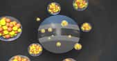 Vue d’artiste des ions de calcium lancés à grande vitesse sur une cible de californium en rotation pour produire des atomes d’oganesson. © Lawrence Livermore National Laboratory