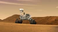 Le rover Curiosity (une vue d'artiste, bien sûr), tel qu'il doit se présenter actuellement, sur la planète Mars. Le mât est levé, ou va le faire, pour commencer à inspecter les alentours. © JPL, Caltech