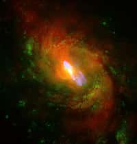 Image composite de la galaxie M 77 en superposant des vues dans différentes longueurs d'onde. Le visible est observé par le télescope Hubble, le domaine radio par le VLA et les rayons X par le satellite Chandra. © Nasa/CXC/MIT/C. Canizares, D. Evans et al./STScI/NSF/NRAO/VLA
