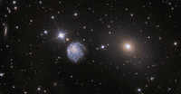 La galaxie spirale NGC 2276 déformée par la gravité dans son environnement. © Hubble, Nasa