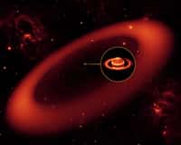 Une vue d'artiste montrant l'anneau géant autour de Saturne si l'on pouvait voir en infrarouge. L'image de Saturne est en revanche bien réelle, bien qu'en fausses couleurs. Elle a été prise dans l'infrarouge avec les instruments du Keck à Hawaï. Crédit : NASA/JPL-Caltech/Keck
