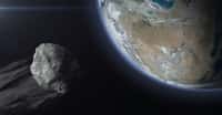 Illustration d'un astéroïde survolant la Terre. © revers_jr, Adobe Stock