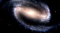 NGC 1300, une galaxie spirale barrée. Sur cette image du télescope spatial Hubble prise en 2005, on peut observer la galaxie spirale barrée NGC 1300. Ce type de galaxies correspond à des galaxies spirales dont les bras spiraux n’émergent pas du centre de la galaxie mais d’une barre constituée d’étoiles traversant ce centre. Les astronomes pensent que deux tiers des galaxies spirales sont barrées. NGC 1300 est située à environ 61 millions d’années-lumière de la Terre, dans la constellation de l’Éridan. Elle a été découverte par John Herschel en 1835. L’analyse des données suggère qu’il s’agit d’une galaxie jeune. Constellation de l’Éridan. © Nasa, Esa, Hubble Heritage Team, Wikimedia Commons, DP