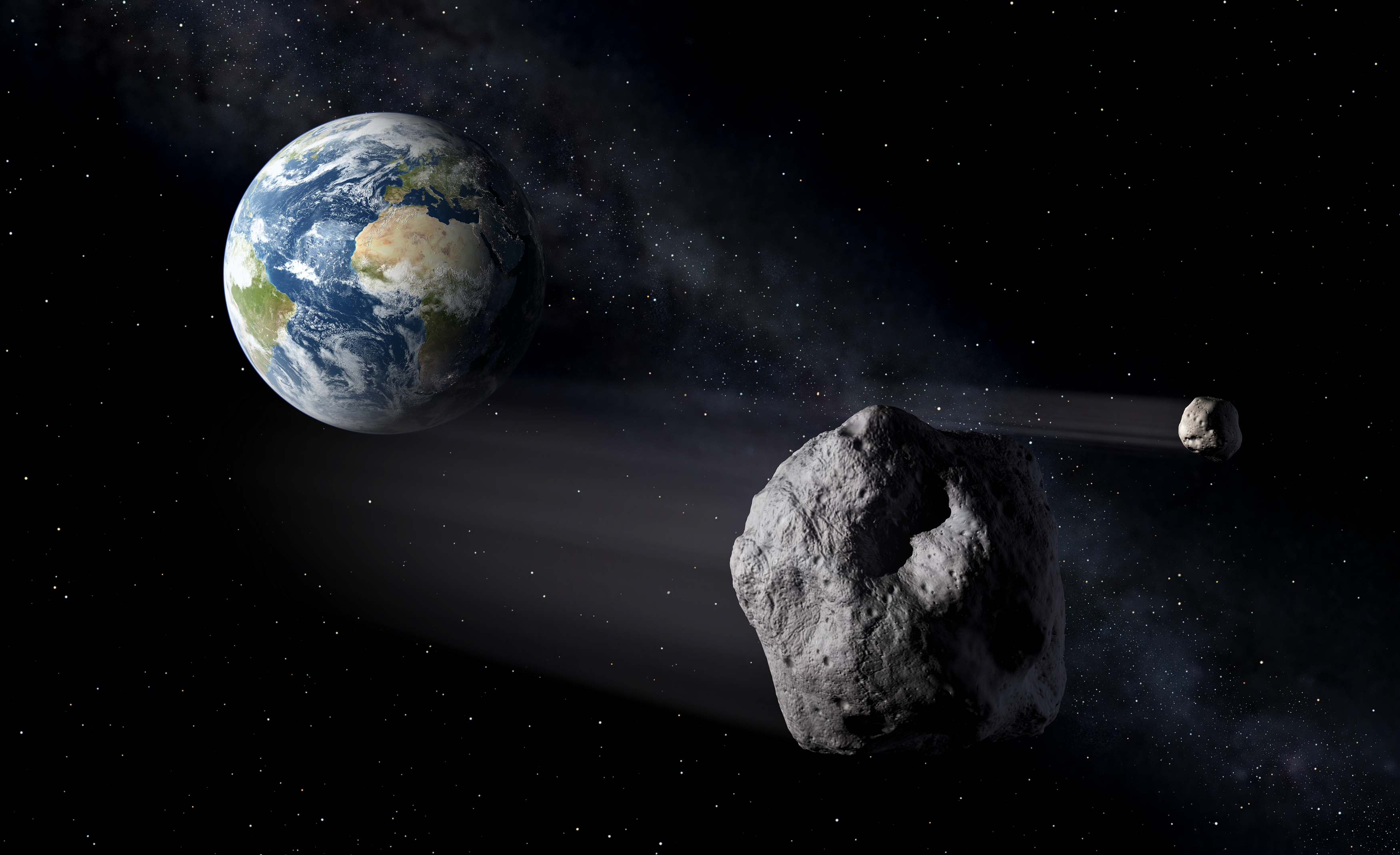 Vue d'artiste d'un astéroïde s'approchant de la Terre.&nbsp;© ESA,&nbsp;P.Carril