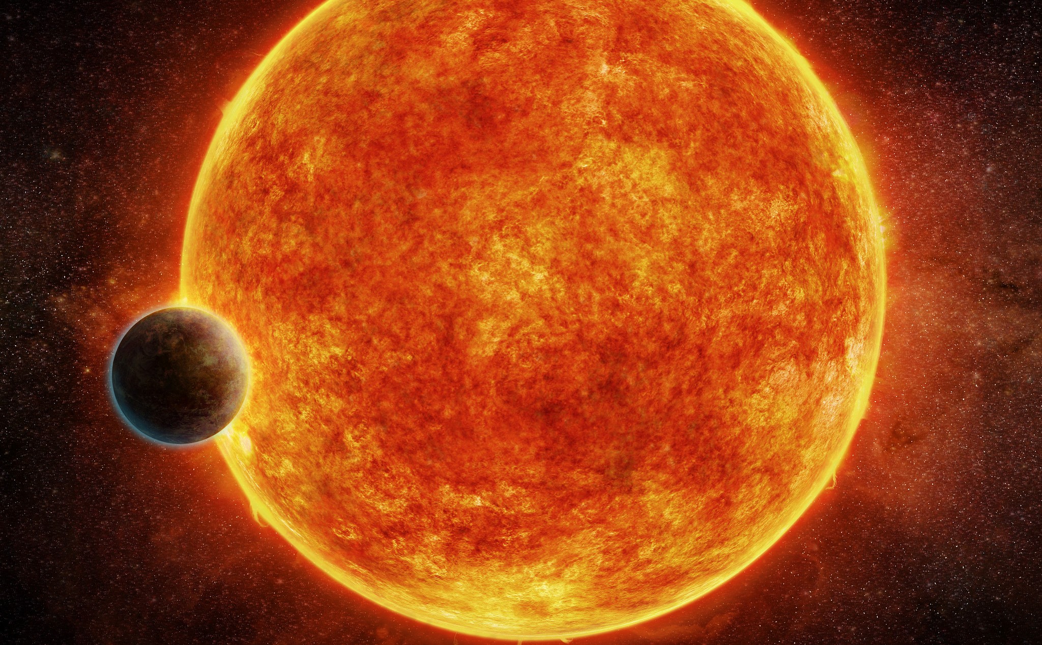 Cette planète se situe au sein de la zone habitable – propice à l’existence d’eau liquide – qui entoure son étoile hôte, une naine rouge de faible luminosité baptisée LHS 1140. La planète avoisine les 6,6 masses terrestres. Elle est ici représentée au moment de son transit devant LHS 1140. En bleu, figure l’atmosphère qui l’entoure probablement. © M. Weiss, CfA