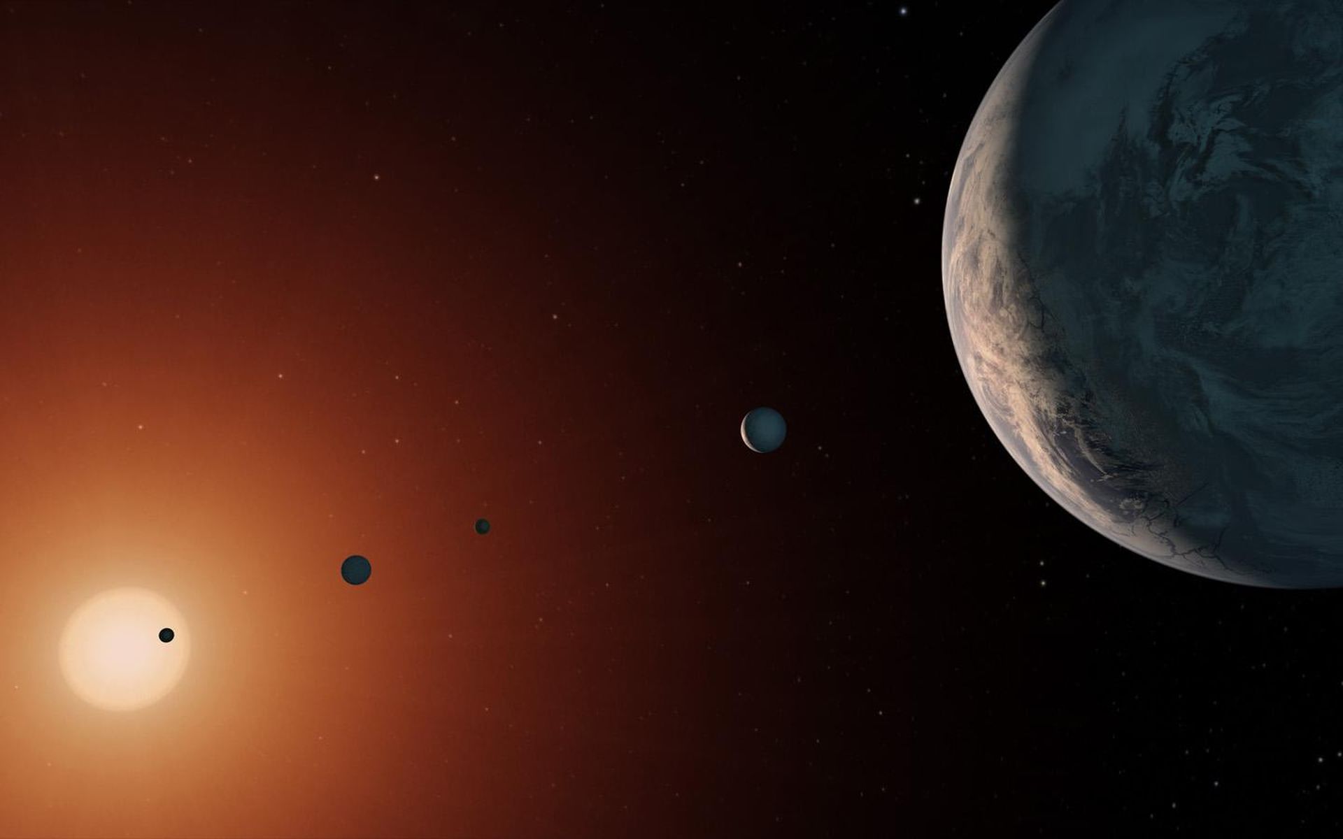 L'étoile Trappist-1 est-elle trop vieille pour abriter de la vie ? Ici, illustration du système de Trappist-1. Sept planètes rocheuses gravitent autour de cette naine rouge. Trois d’entre elles sont dans la zone habitable. © Nasa, JPL-Caltech