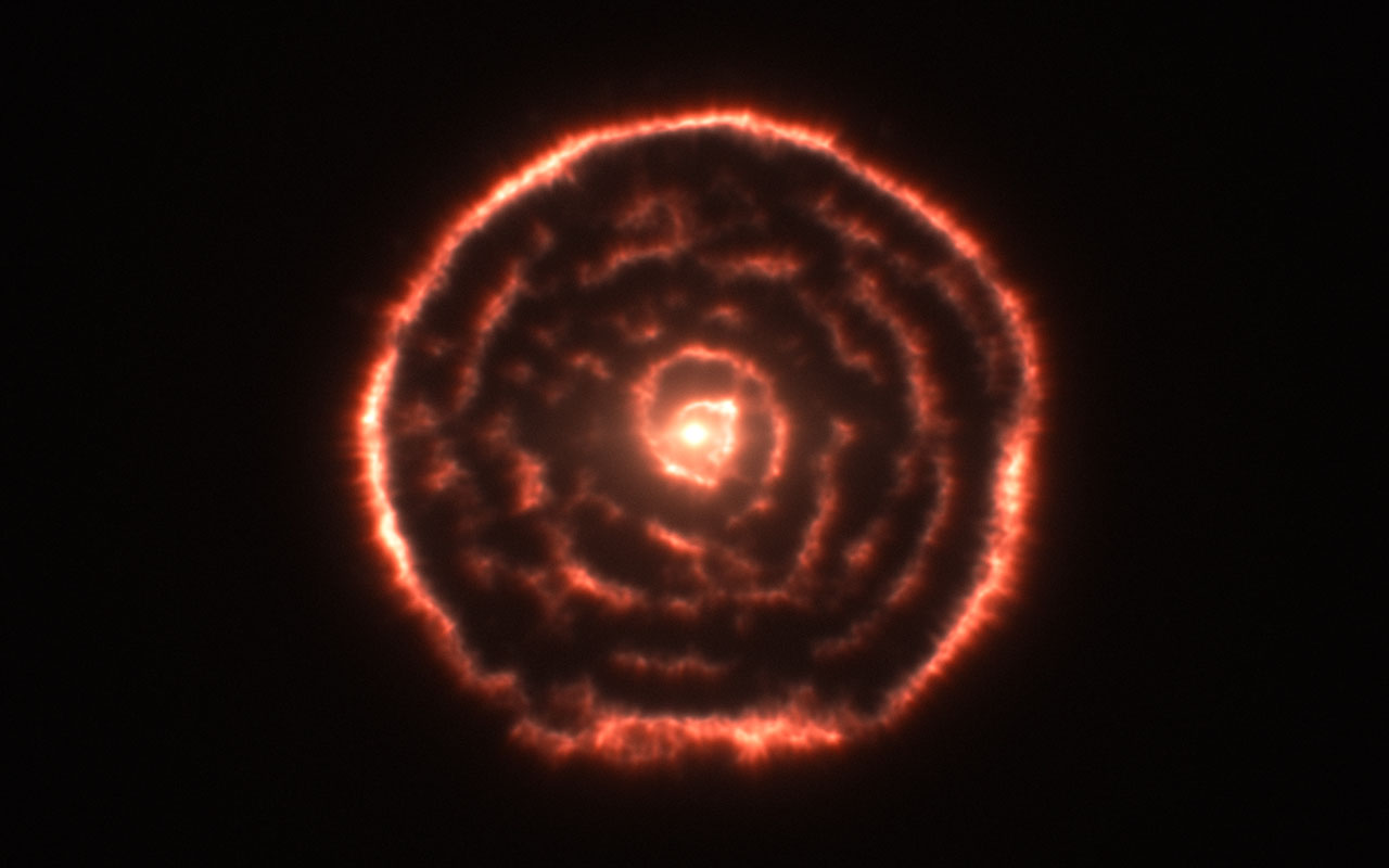 Le réseau d'antennes Alma a découvert une curieuse spirale de matière qui s'échappait de l'étoile géante rouge R. Sculptoris. © Alma, ESO, NAOJ, NRAO
