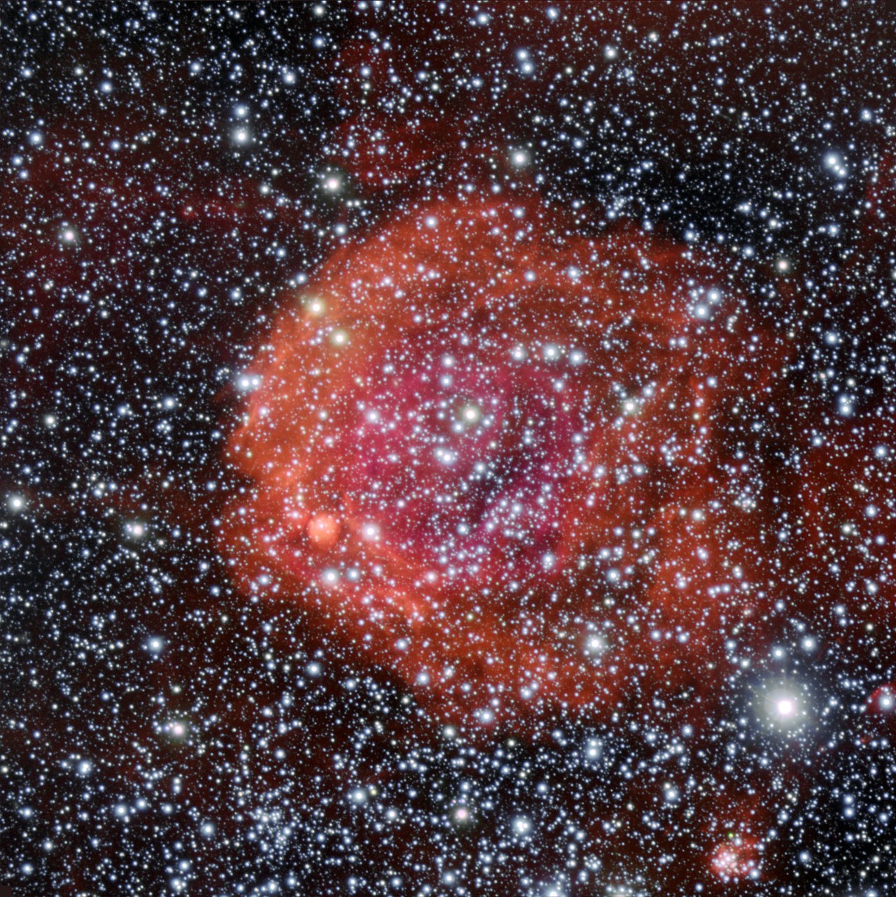 NGC 371, un jeune amas d'étoiles plongé dans une nébuleuse à émission dans le Petit Nuage de Magellan. © ESO/Manu Mejias