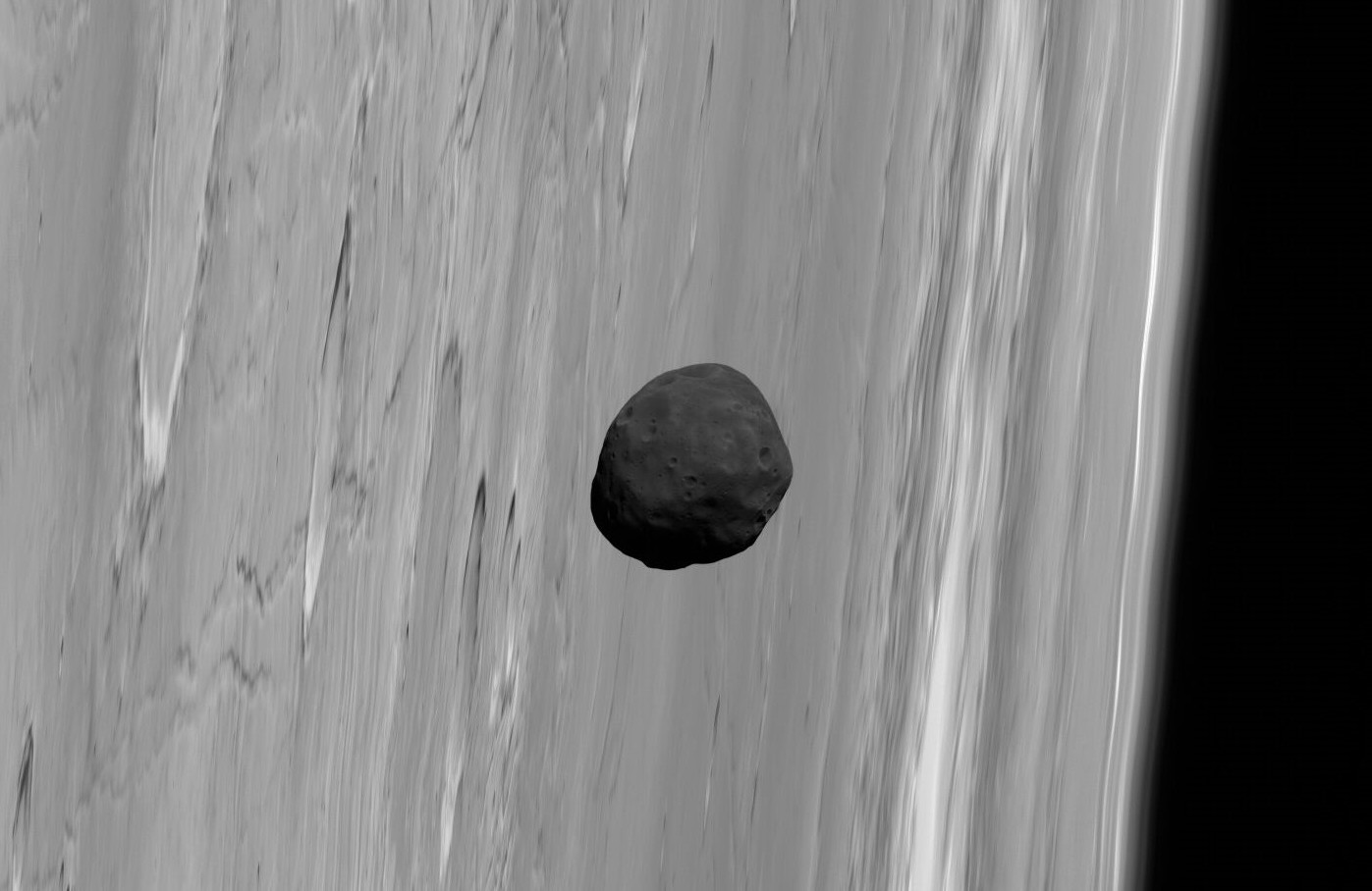 Phobos, un sombre satellite qui passe devant Mars. © G. Neukum (FU Berlin) et al./Mars Express/DLR/Esa
